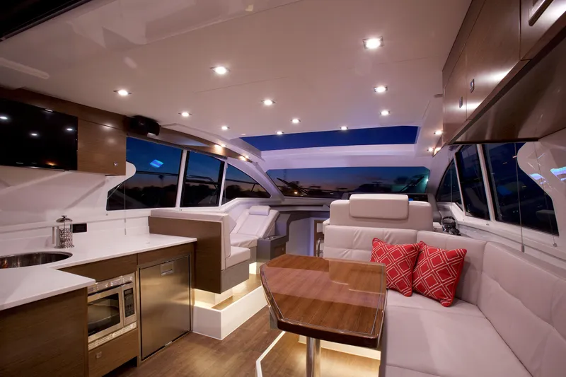  Yacht Photos Pics Luxurious interior of 2026 Cruisers Yachts 42 Cantius with modern kitchen and seating area.
