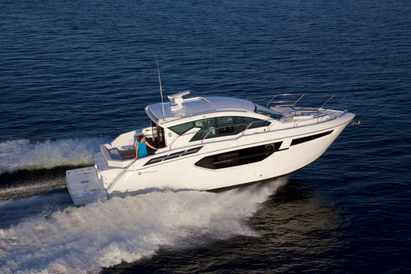 Yacht Photos Pics 2026 Cruisers Yachts 42 Cantius cruising on open water, side view.