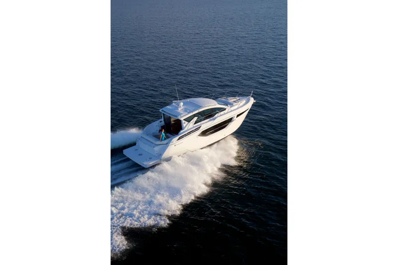  Yacht Photos Pics 2026 Cruisers Yachts 42 Cantius cruising on open water, showcasing sleek design and performance.