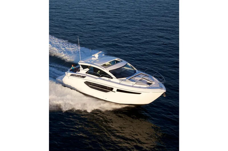  Yacht Photos Pics 2026 Cruisers Yachts 42 Cantius cruising on open water, showcasing sleek design.