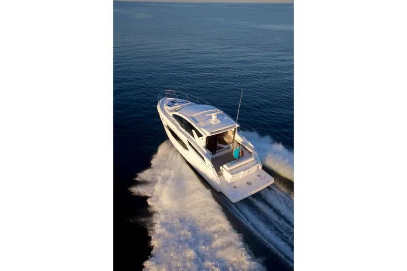  Yacht Photos Pics 2026 Cruisers Yachts 42 Cantius cruising on open water, aerial view.