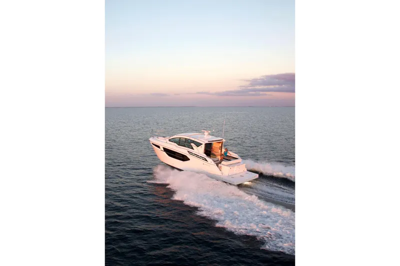  Yacht Photos Pics 2026 Cruisers Yachts 42 Cantius cruising at sunset on open water.