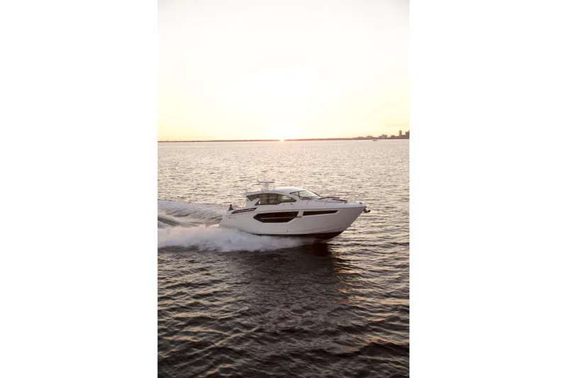  Yacht Photos Pics 2026 Cruisers Yachts 42 Cantius cruising at sunset on open water.