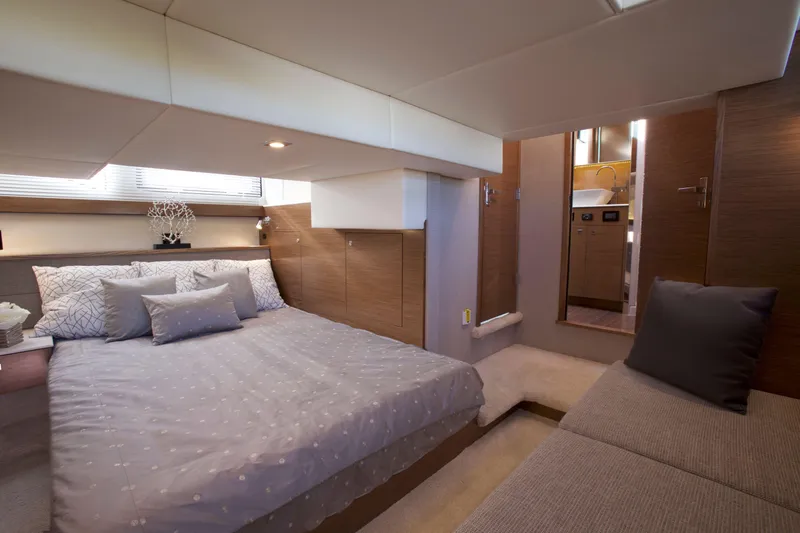  Yacht Photos Pics Luxurious bedroom interior of 2026 Cruisers Yachts 42 Cantius with modern design.
