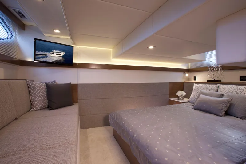 Yacht Photos Pics Luxurious interior of 2026 Cruisers Yachts 42 Cantius with elegant bedroom and seating area.