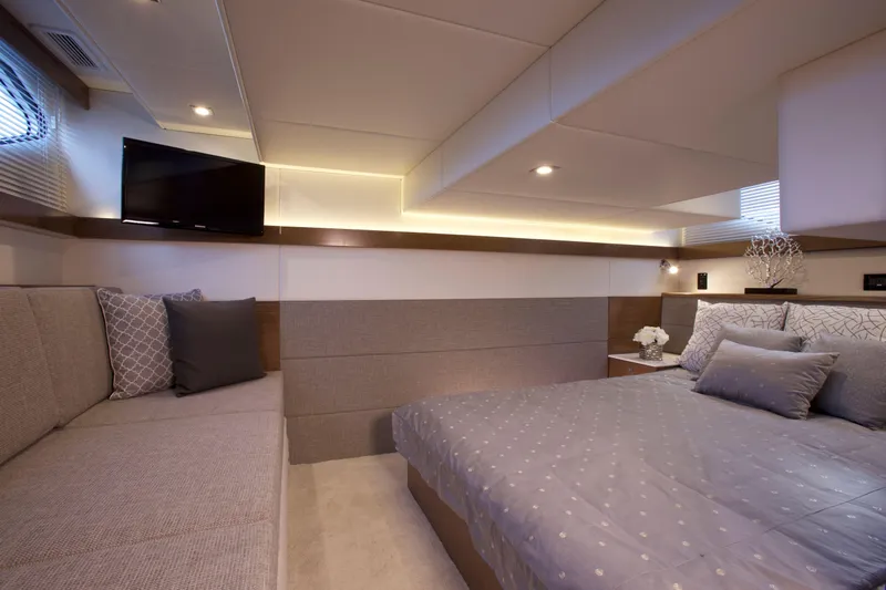  Yacht Photos Pics Luxurious interior of 2026 Cruisers Yachts 42 Cantius with elegant bedding and seating.
