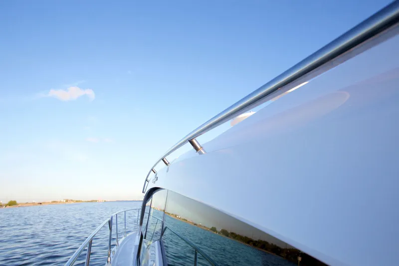  Yacht Photos Pics 2026 Cruisers Yachts 42 Cantius on calm water under clear blue sky.