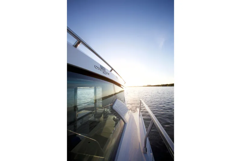  Yacht Photos Pics 2026 Cruisers Yachts 42 Cantius on serene water at sunset.