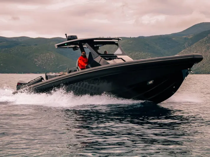 Skipper 42 Triple 500r Yacht Photos Pics Skipper-BSK 42 boat cruising on water, 2026 model, with scenic mountain backdrop.