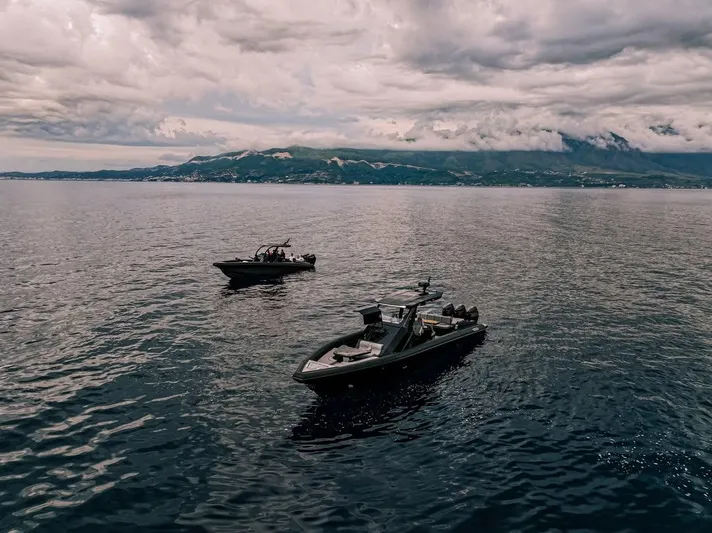 Skipper 42 Triple 500r Yacht Photos Pics Two Skipper-BSK 42 boats on a calm sea under cloudy skies, 2026 model.