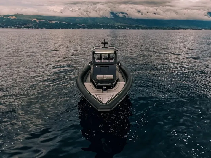 Skipper 42 Triple 500r Yacht Photos Pics Skipper-BSK 42 boat on calm sea with mountainous backdrop, 2026 model.