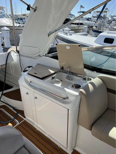  Yacht Photos Pics 2009 Formula 310 BR boat interior with kitchenette and seating area.