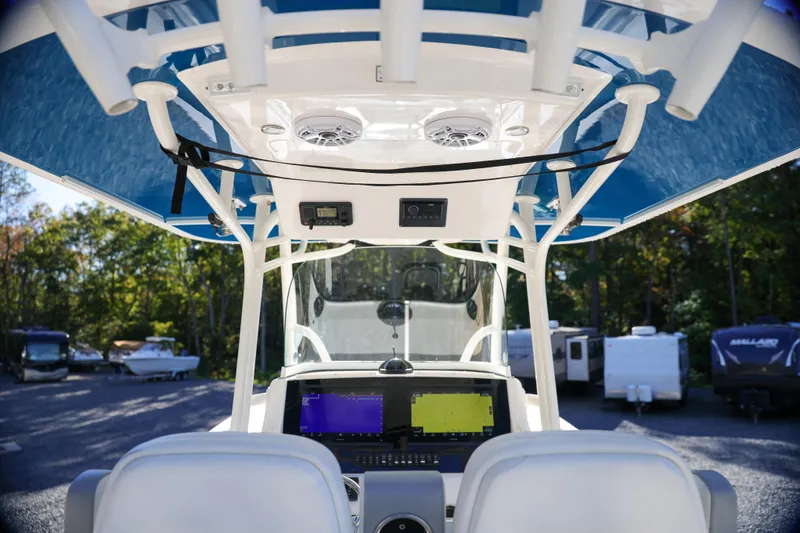  Yacht Photos Pics 2019 Regulator 28 boat cockpit with dual screens and overhead speakers.