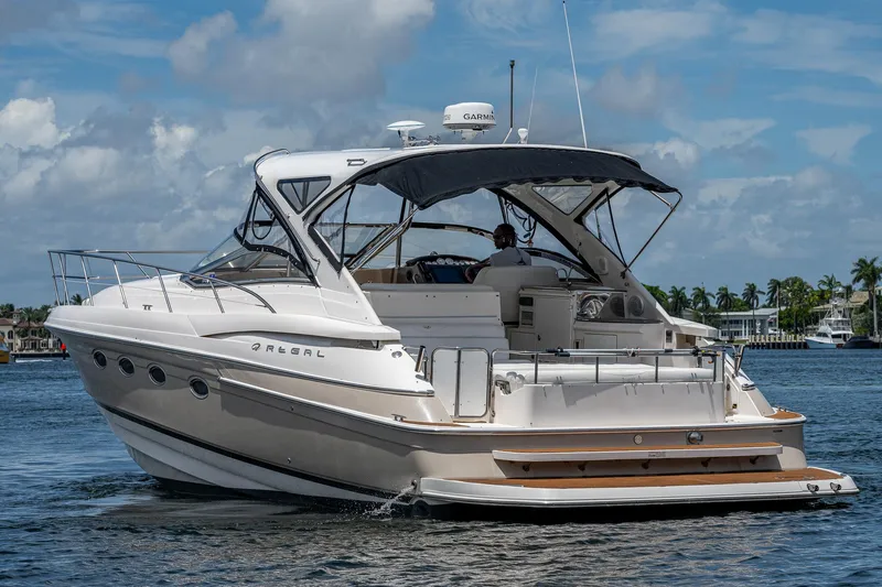  Yacht Photos Pics 2006 Regal Commodore 4460 yacht cruising on a sunny day.