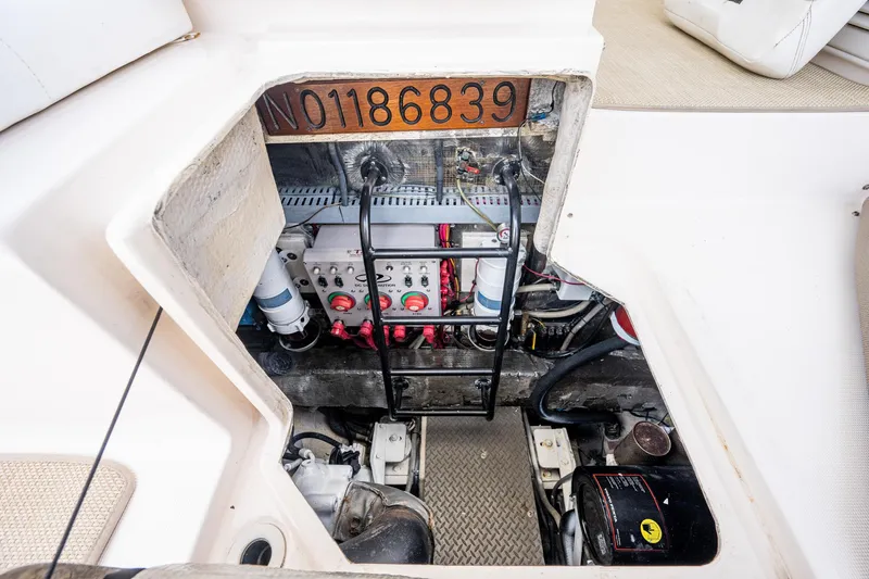  Yacht Photos Pics Engine compartment of 2006 Regal Commodore 4460 boat, showcasing mechanical components and wiring.