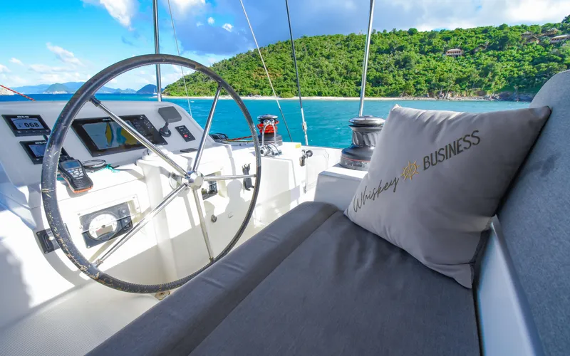 Whiskey Business Yacht Photos Pics Lagoon 450F 2015 yacht helm with scenic ocean view and plush seating.