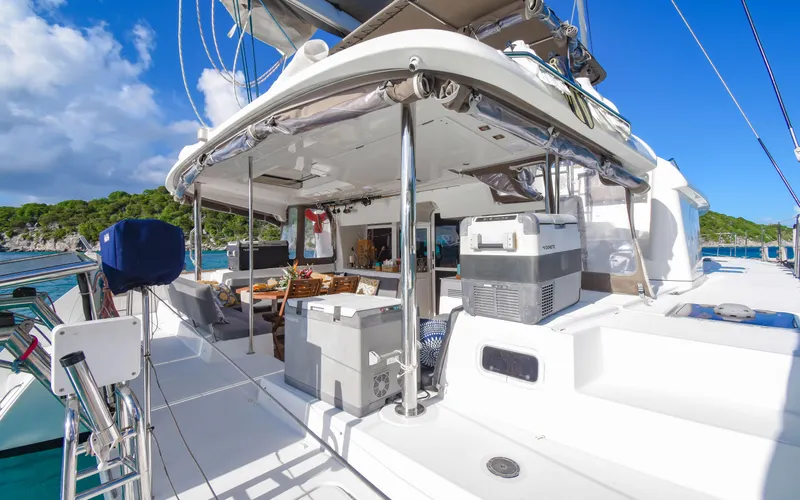 Whiskey Business Yacht Photos Pics 2015 Lagoon 450F catamaran with spacious deck and modern amenities, docked in a scenic marina.