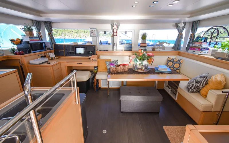 Whiskey Business Yacht Photos Pics Luxurious interior of a 2015 Lagoon 450F catamaran with modern decor and ample seating.