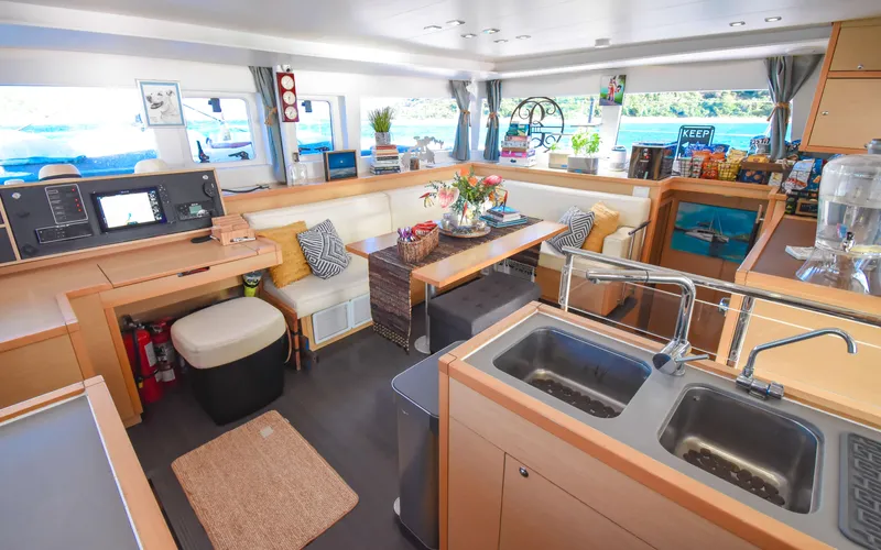 Whiskey Business Yacht Photos Pics Interior of 2015 Lagoon 450F catamaran, featuring modern kitchen and cozy seating area.