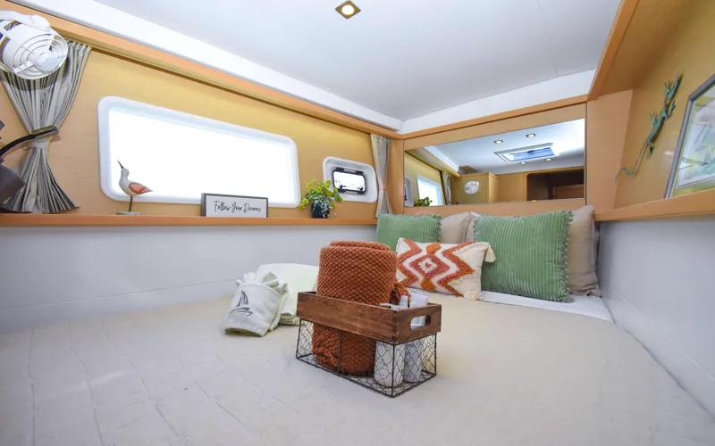 Whiskey Business Yacht Photos Pics Cozy interior of 2015 Lagoon 450F yacht with stylish decor and comfortable bedding.