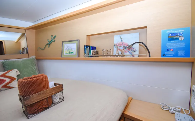 Whiskey Business Yacht Photos Pics Cozy cabin interior of 2015 Lagoon 450F yacht with decorative accents and shelving.