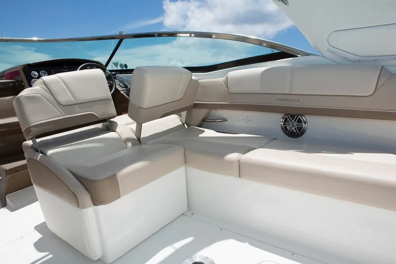 Opty Mystic Yacht Photos Pics 2018 Formula 310 Sun Sport boat interior with beige seating and modern dashboard.