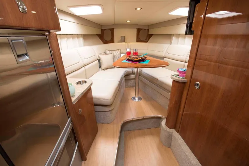 Opty Mystic Yacht Photos Pics 2018 Formula 310 Sun Sport cabin with luxurious seating and dining area.