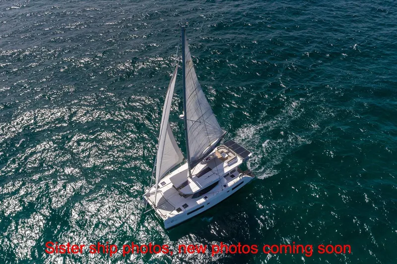 Just Lion Around Yacht Photos Pics Aerial view of 2020 Leopard 45 sailing catamaran on open sea.