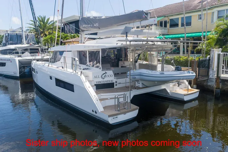 Just Lion Around Yacht Photos Pics 2020 Leopard 45 catamaran docked, featuring sleek design and spacious deck area.