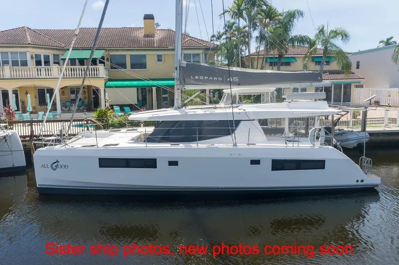 Just Lion Around Yacht Photos Pics 2020 Leopard 45 catamaran docked by waterfront homes, labeled "All Good."