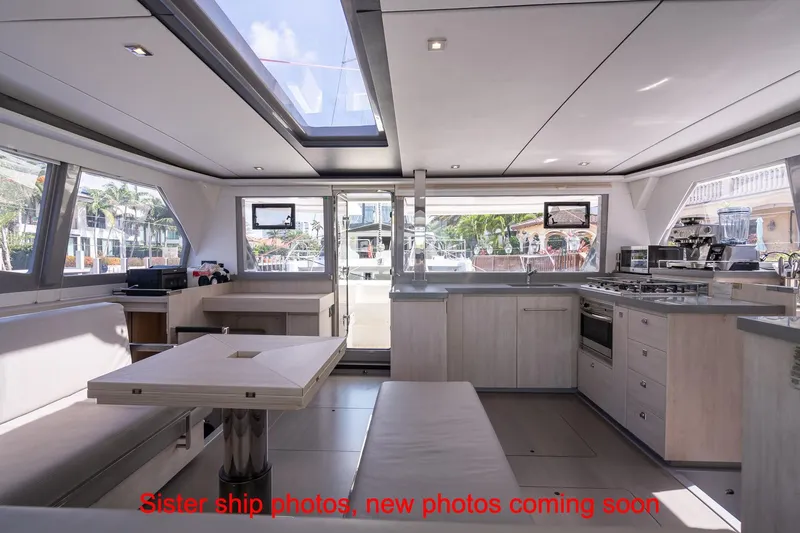 Just Lion Around Yacht Photos Pics Modern interior of 2020 Leopard 45 catamaran with spacious kitchen and dining area.