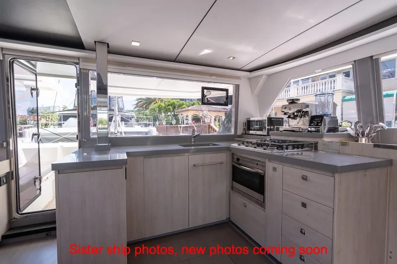 Just Lion Around Yacht Photos Pics Modern kitchen interior on a 2020 Leopard 45 catamaran, featuring sleek appliances and ample counter space.