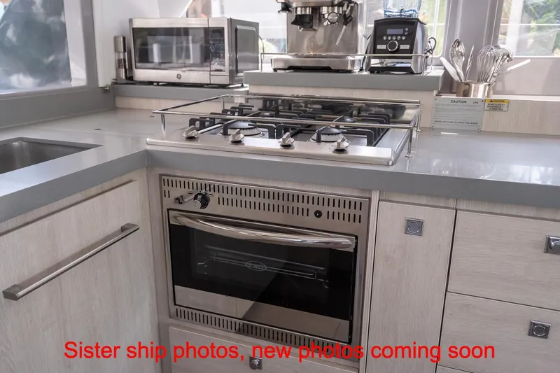 Just Lion Around Yacht Photos Pics Modern kitchen in 2020 Leopard 45 yacht with stove, oven, and appliances.