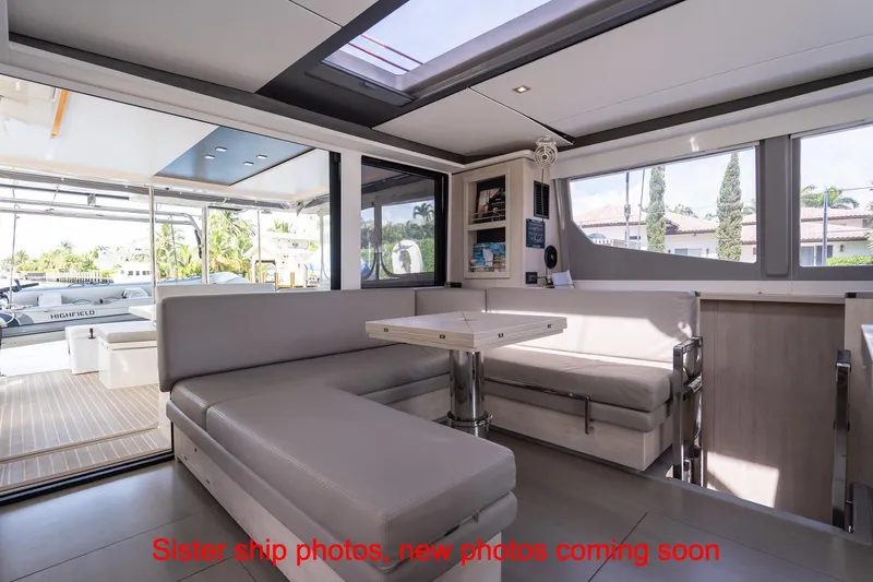 Just Lion Around Yacht Photos Pics Modern interior of 2020 Leopard 45 yacht with spacious seating and large windows.