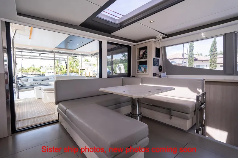 Just Lion Around Yacht Photos Pics Interior of 2020 Leopard 45 yacht with modern seating and dining area.