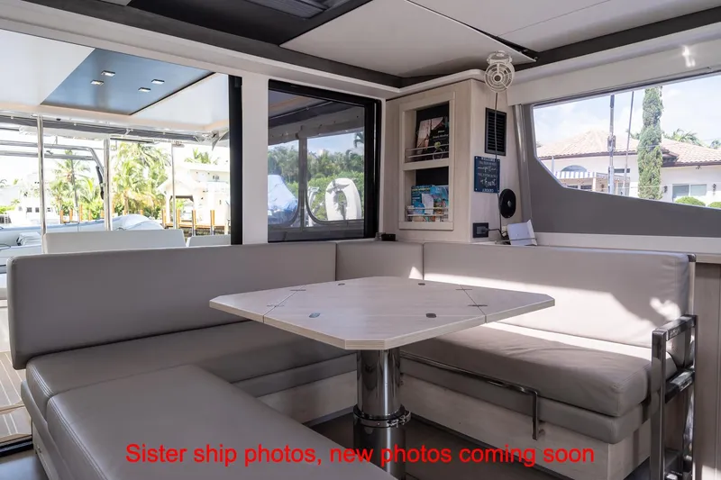 Just Lion Around Yacht Photos Pics Interior of 2020 Leopard 45 yacht with modern seating and table arrangement.