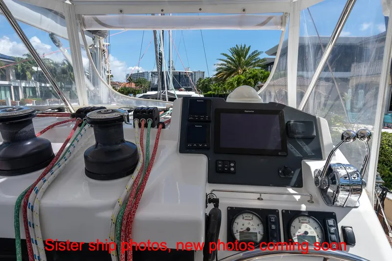 Just Lion Around Yacht Photos Pics Helm of 2020 Leopard 45 catamaran with navigation equipment and winches, docked in marina.