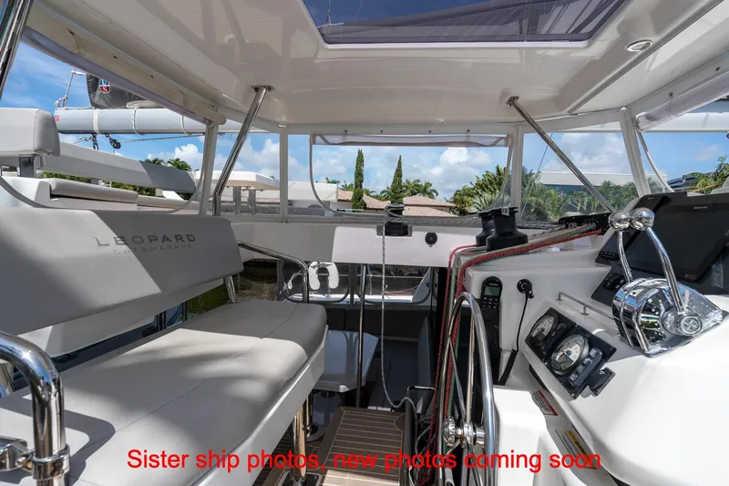 Just Lion Around Yacht Photos Pics Interior view of a 2020 Leopard 45 catamaran cockpit with modern navigation equipment.