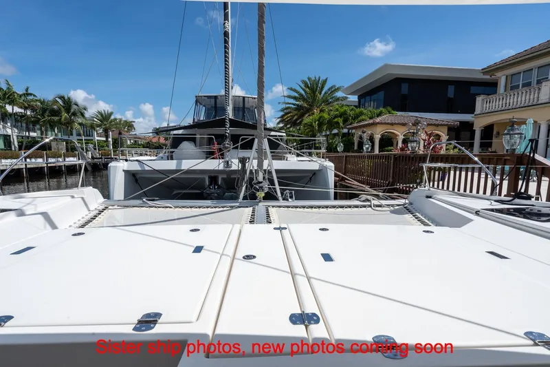 Just Lion Around Yacht Photos Pics 2020 Leopard 45 catamaran docked, showcasing spacious deck and modern design.