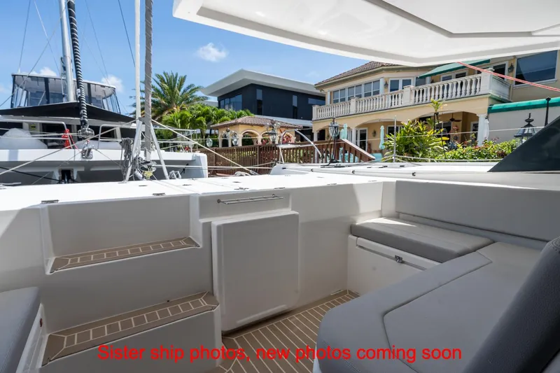 Just Lion Around Yacht Photos Pics Leopard 45 catamaran deck view, 2020 model, docked near waterfront homes.