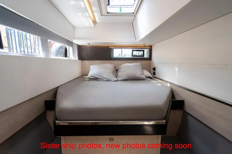 Just Lion Around Yacht Photos Pics Interior cabin of 2020 Leopard 45 yacht with bed and windows.