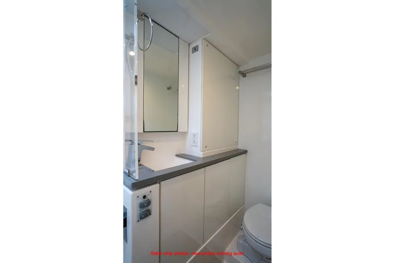 Just Lion Around Yacht Photos Pics Modern bathroom in 2020 Leopard 45 yacht, featuring sleek cabinetry and fixtures.