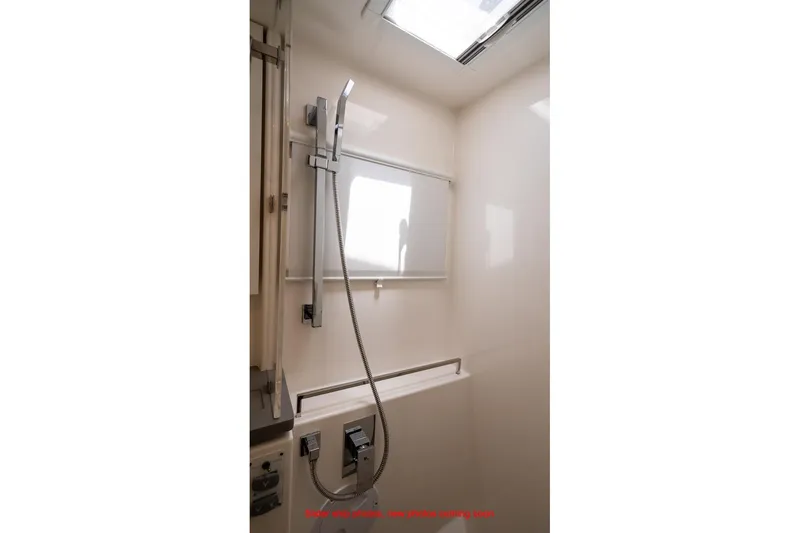 Just Lion Around Yacht Photos Pics Modern shower area in 2020 Leopard 45 yacht with sleek fixtures and skylight.