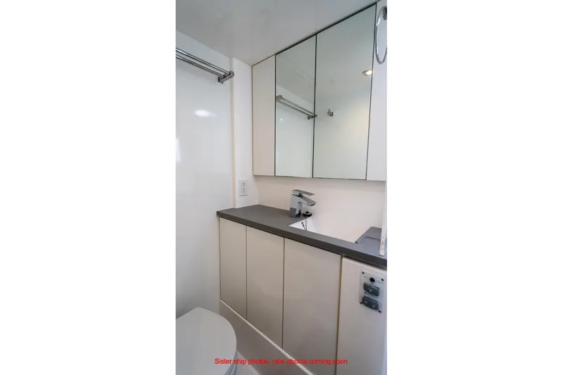 Just Lion Around Yacht Photos Pics Modern bathroom in 2020 Leopard 45 yacht with sleek cabinetry and mirrored storage.