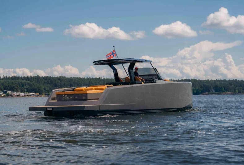  Yacht Photos Pics 2024 Pardo Yachts P43 cruising on a lake under a clear blue sky.