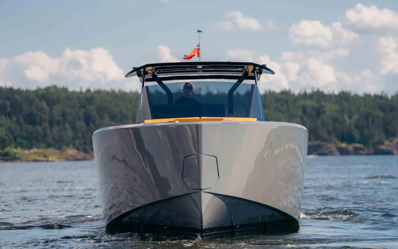  Yacht Photos Pics 2024 Pardo Yachts P43 cruising on a scenic lake with forested background.