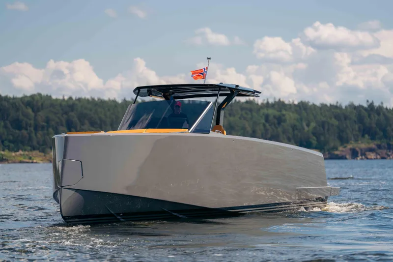  Yacht Photos Pics 2024 Pardo Yachts P43 cruising on a scenic lake with forested shoreline.