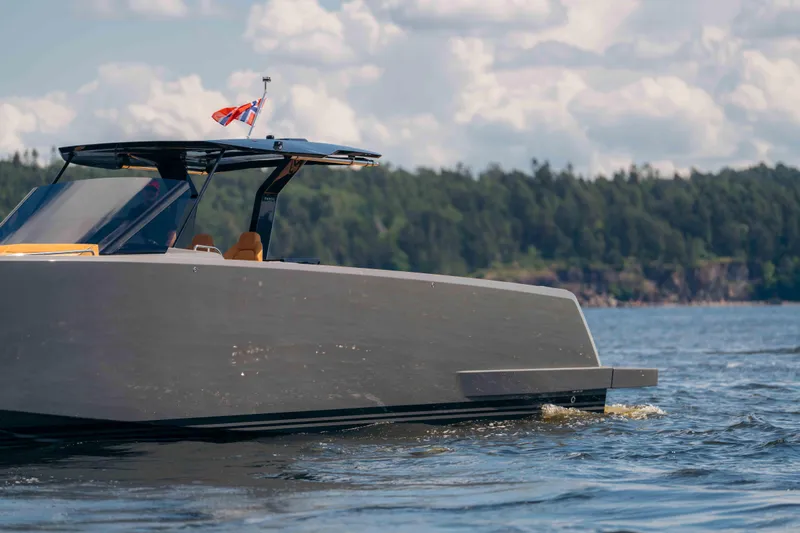  Yacht Photos Pics 2024 Pardo Yachts P43 cruising on a scenic lake with forested shoreline.