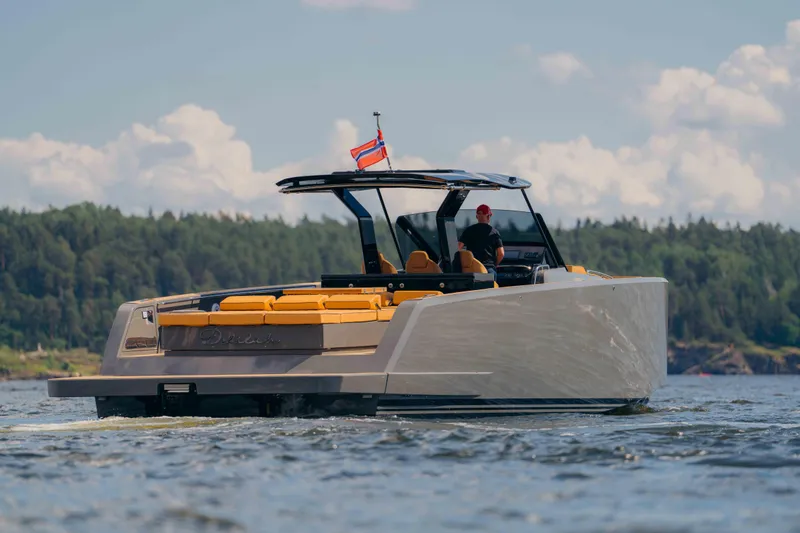  Yacht Photos Pics 2024 Pardo Yachts P43 cruising on a scenic lake with lush forest backdrop.