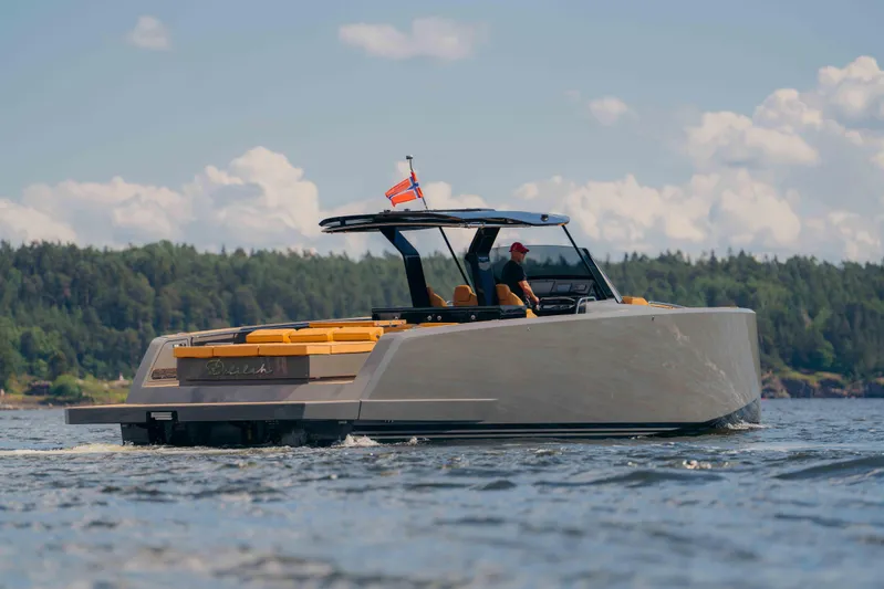  Yacht Photos Pics 2024 Pardo Yachts P43 cruising on a serene lake with lush forest backdrop.
